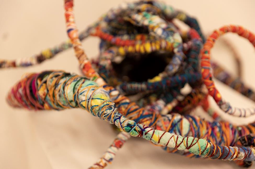 wire and colorful string woven and entangled with itself